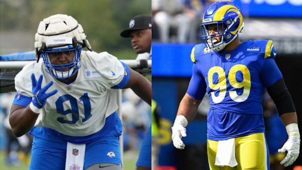 Los Angeles Rams defensive tackles Kobie Turner (91) and Aaron Donald (99).